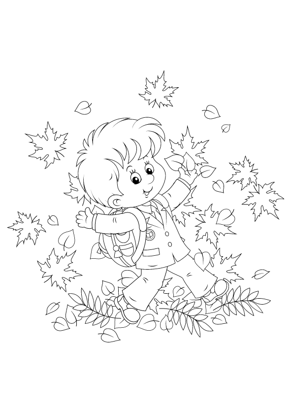 Schoolboy with autumn leaves